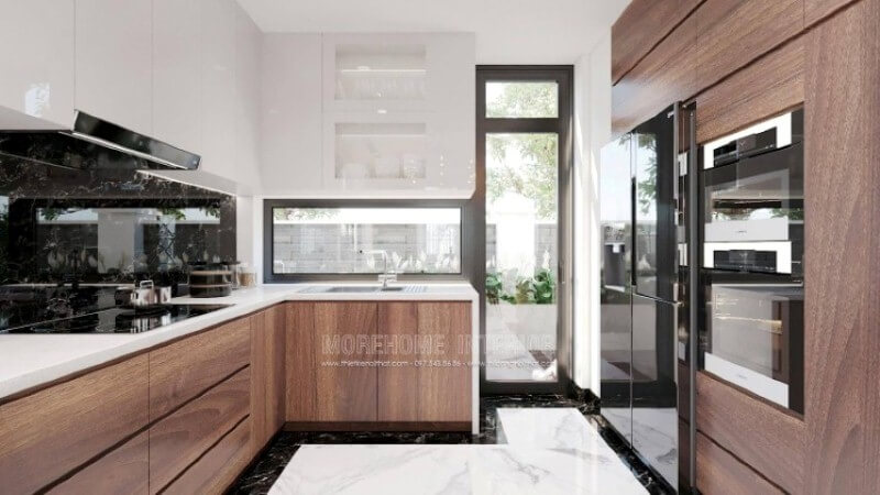 Nếu bạn đã được xem các mẫu tủ bếp đẹp có tay nắm, thì có thể những mẫu tủ bếp đó đã lỗi thời, thiết kế phòng bếp với toàn bộ bề mặt cánh tủ trơn nhẵn là một sự đổi mới hoàn hảo, không chút tay cầm nhưng lại kéo đẩy dễ dàng nhờ ý tưởng thiết kế vát từ cánh tủ giúp bề mặt gọn gàng mà đẹp mắt. Thiết kế và sản xuất tủ bếp đẹp